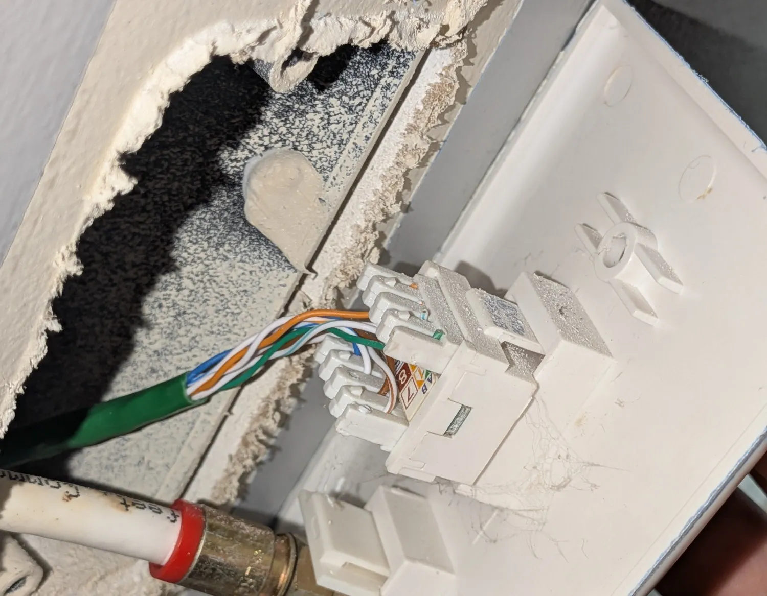 the old keystone jacks in the outlet The old phone wiring in the outlet